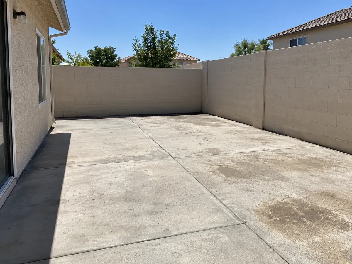Desert Oasis Patio with a Shade Sail — Before