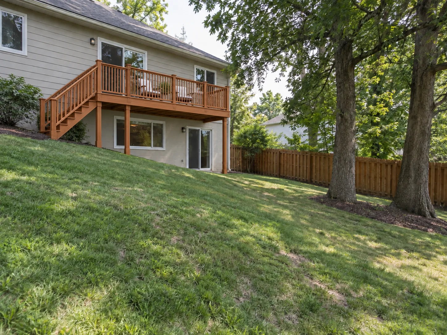 Raised Western Red Cedar Deck on a Sloped Backyard — After