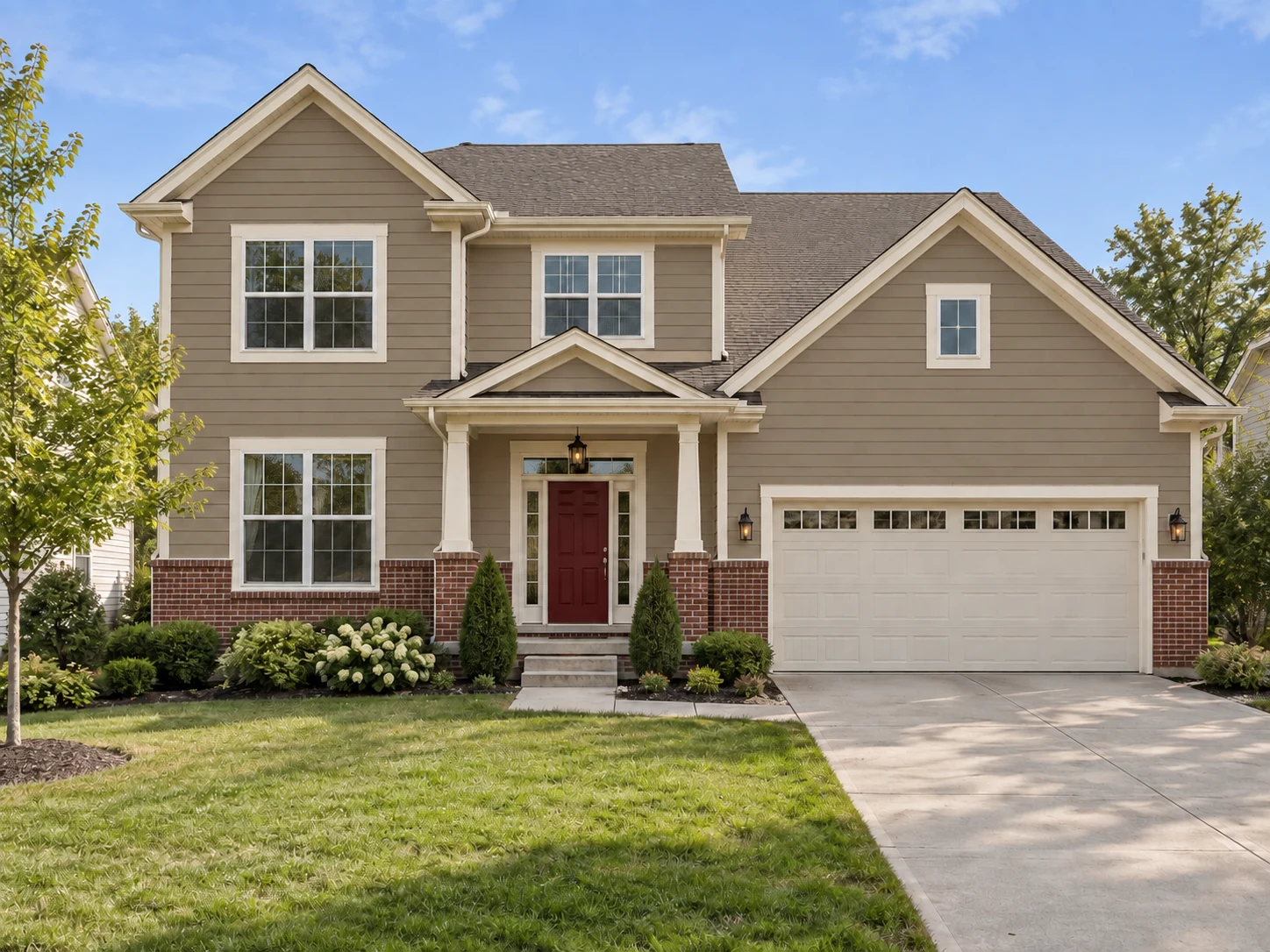 Taupe Siding and a Barn Red Door Above Brick — After